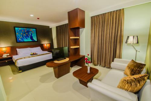 Gulta vai gultas numurā naktsmītnē Noormans Hotel Semarang