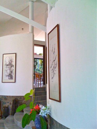 a living room with a picture on the wall at Puncak Air Manis Residence in Padang