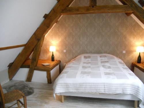 מיטה או מיטות בחדר ב-Gîte La Nuit Étoilée chez Champagne Mathelin