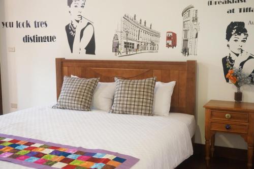 Postel nebo postele na pokoji v ubytování Tainan Yi Home