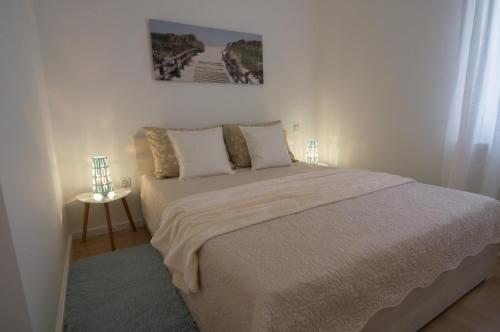 Posteľ alebo postele v izbe v ubytovaní Paula Apartment