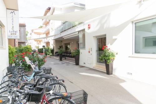 a row of bikes parked outside of a building at Hotel Miramare Dipendenza in Pineto