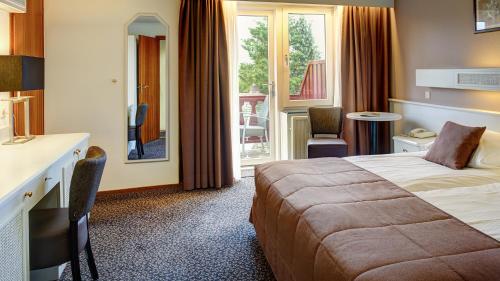 Ліжко або ліжка в номері Hotel Berg en Dal