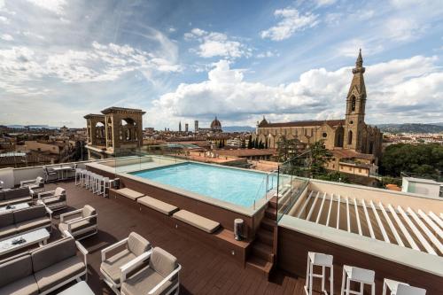 a view from the rooftop of a building with a swimming pool at Plaza Hotel Lucchesi in Florence