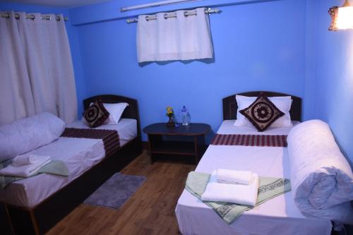 Tempat tidur dalam kamar di Subha Guest House