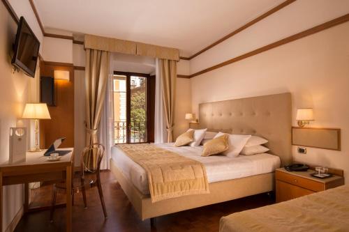 מיטה או מיטות בחדר ב-La Residenza