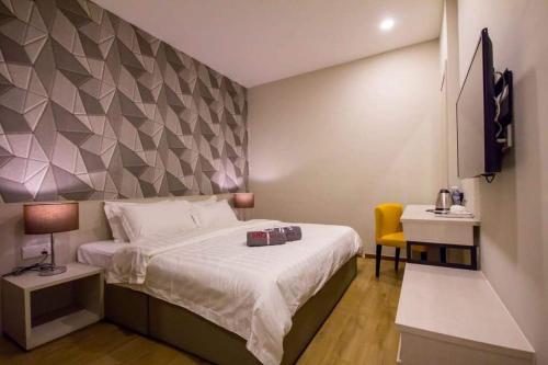 Postel nebo postele na pokoji v ubytování OMG Hotel