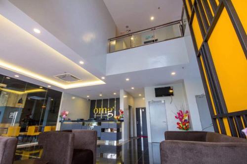 TV a/nebo společenská místnost v ubytování OMG Hotel