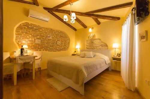 Postel nebo postele na pokoji v ubytování Rooms Villa Duketis