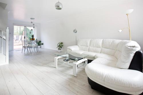 a living room with two white couches and a table at Gala Rooms Homestay - Free Parking in Edinburgh