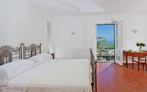 Postel nebo postele na pokoji v ubytování Villa Oriana Relais