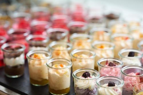 a group of cups filled with different types of desserts at Club del Sol Aparthotel in Port de Pollensa