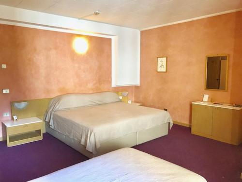 Postel nebo postele na pokoji v ubytování Hotel 2 Magnolie