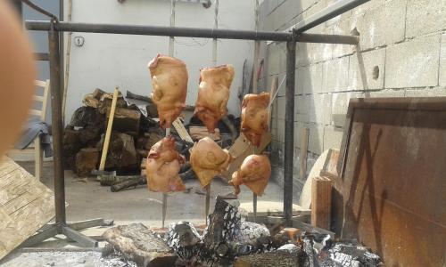 a group of chickens hanging over a fireplace at Agriturismo Locoe in Oliena