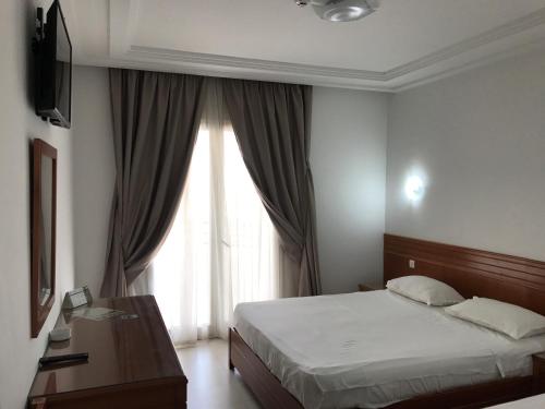 Ліжко або ліжка в номері Hotel AL KARMEL