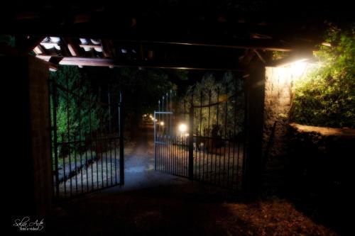 an entrance to a gate at night at L'Antica Vigna in Randazzo