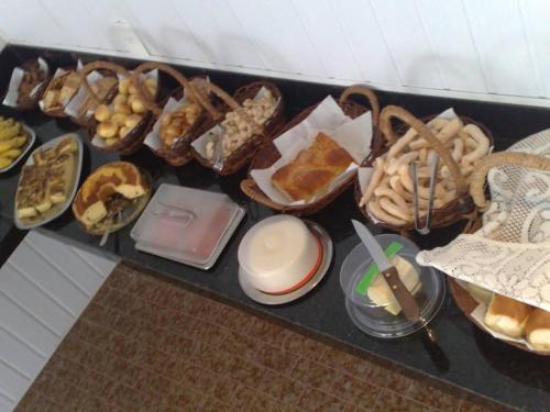 a table with many different types of food on it at Panorama Hotel in Salinas