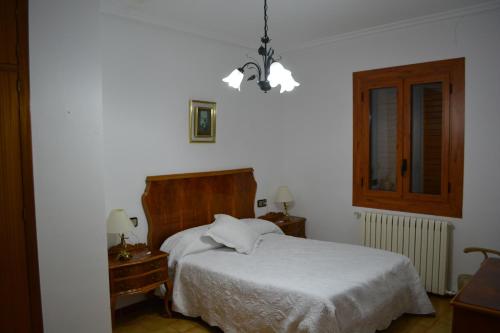 Un pat sau paturi într-o cameră la Casa Solatillo