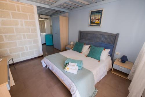 Ένα ή περισσότερα κρεβάτια σε δωμάτιο στο Albergo isola mia