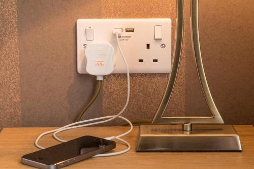 a light plugged into a outlet on a table at Hermiston Guest House in Keswick