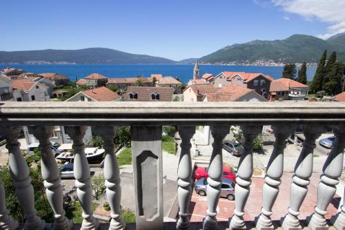 a view of a city from a balcony at St. Roko Guest House in Tivat