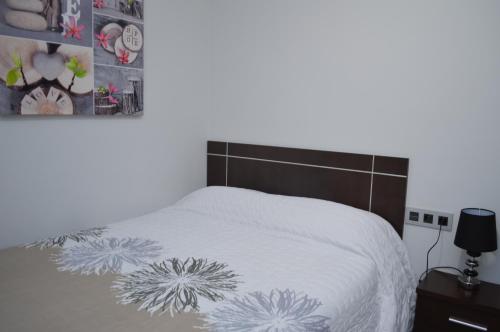 Posteľ alebo postele v izbe v ubytovaní Apartamento Prado - Casa Eva