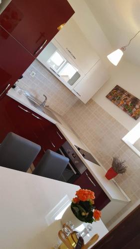 an overhead view of a kitchen with a counter top at Apartments Iva in Pakoštane