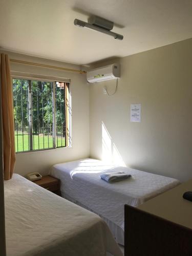Tempat tidur dalam kamar di Hotel Texacao do Cavera