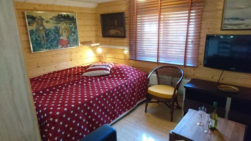 Ένα ή περισσότερα κρεβάτια σε δωμάτιο στο Muskö Havsbad