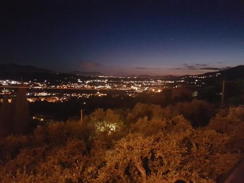 a view of a city at night at Affittacamere Adri in Uzzano