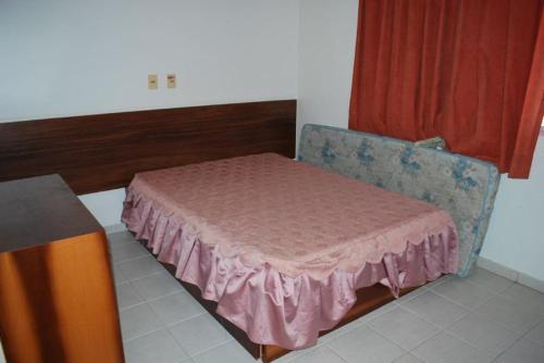 מיטה או מיטות בחדר ב-Prive das Thermas I - 3 Quartos - Achei Ferias