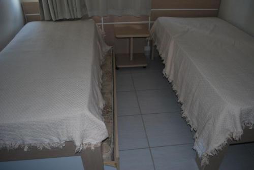 Cama o camas de una habitación en Prive das Thermas II- 3 Quartos - Achei Ferias