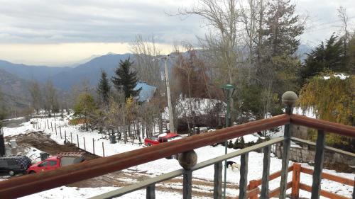 a view from a balcony of a snow covered mountain at Great Chalet Farellones in Farellones