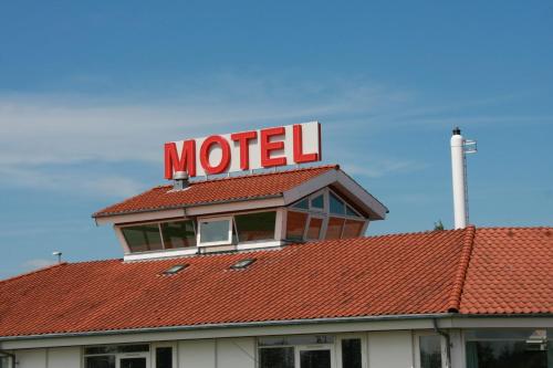 a motel sign on top of a roof at Motel Spar 10 in Viborg