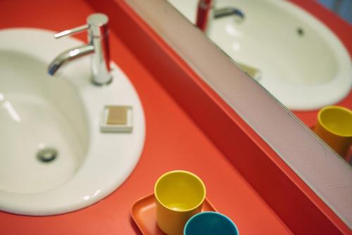 a bathroom with a sink and two sinks at Austin Motel in Austin