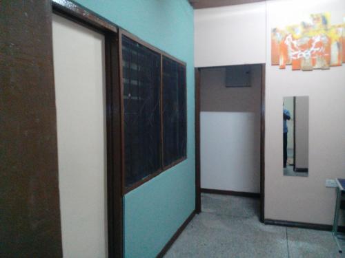 a hallway with a door in a room at Feehi's Place in Accra