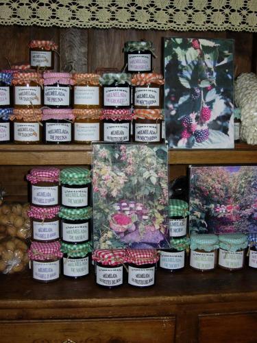 a display of jars of food on a shelf at Casa Rural Era de Ferro in Erill la Vall