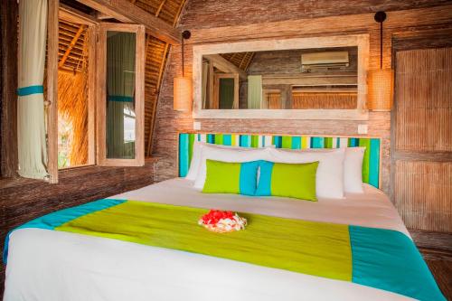 Postel nebo postele na pokoji v ubytování Hai Tide Beach Resort