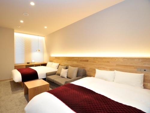 Кровать или кровати в номере hotel androoms Osaka Hommachi