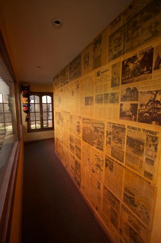 a hallway with posters on the wall of a building at Hostel Cruz del Sur in Ushuaia
