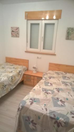 Posteľ alebo postele v izbe v ubytovaní Casa Los Cerezos