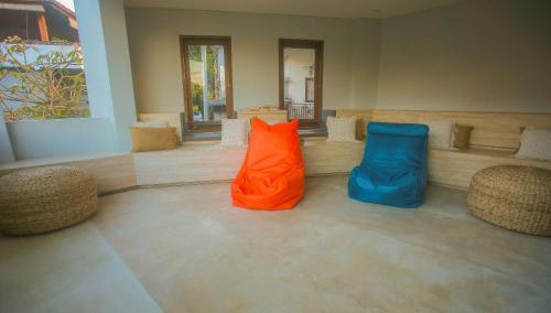 an orange and blue bag sitting in a lobby at Padang-Padang Inn in Uluwatu