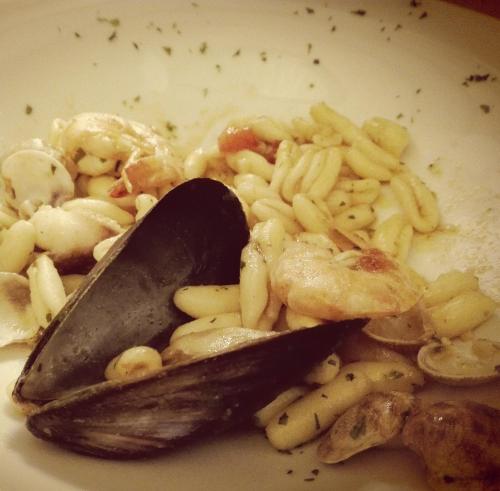 a spoon in a plate of pasta and shrimp at Locanda San Giorgio in Termoli