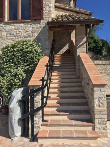 a set of stairs leading up to a building at La Dimora di Francesco in Assisi