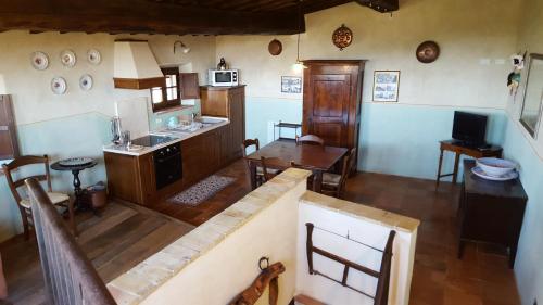an overhead view of a kitchen and dining room at Podere Cunina in Buonconvento