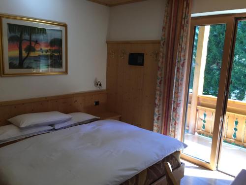 Postel nebo postele na pokoji v ubytování Hotel El Paster