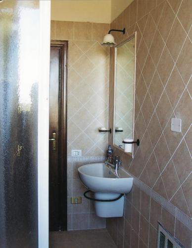a bathroom with a sink and a mirror at Montanari Agrivillage in Narni