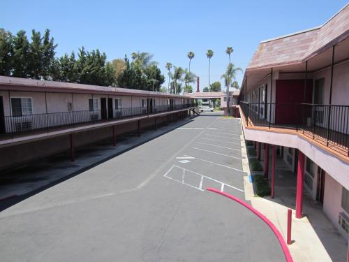 an empty parking lot at a motel at Welcome Inn & Suites Anaheim in Anaheim