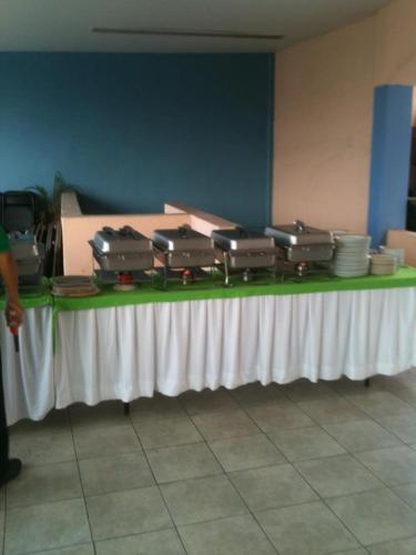 a table with suitcases sitting on top of it at Dorados Acapulco in Acapulco