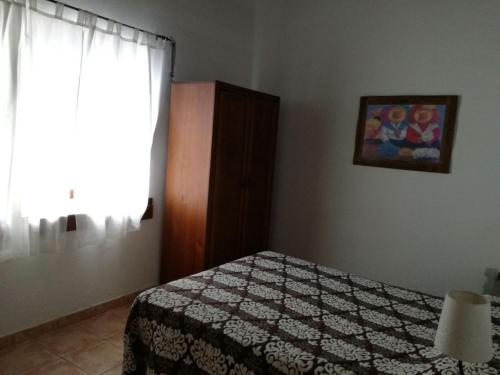Ένα ή περισσότερα κρεβάτια σε δωμάτιο στο Casa Rural Arguamul